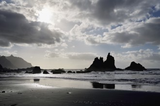 Dramatic clouds with rock formation on the beach of Playa de Benijo, Tenerife, Canary Island,