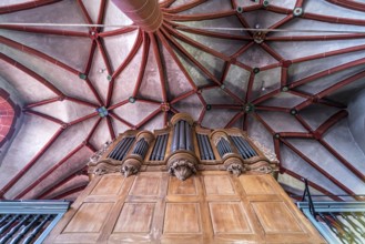 Church organ and star vault in the interior of the Catholic parish church of St Martin in the