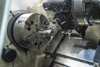 Close-up of a lathe operating in a numerical control factory