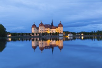 Moritzburg Hunting Lodge with reflection in the castle pond in the evening, Moritzburg, Saxony,
