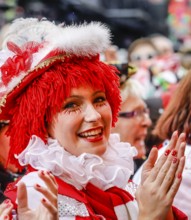 Colourfully costumed carnivalists celebrate carnival in Cologne, on Weiberfastnacht the street