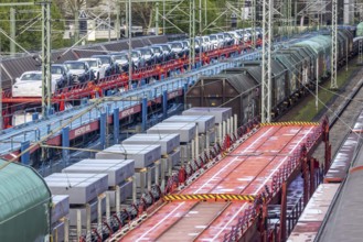 Sindelfingen railway station. Goods trains parked on the tracks. Automotive RailNet. Car transport