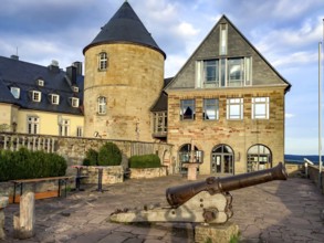 View from Altane to historical cannon in the foreground behind it on the right entrance to torture