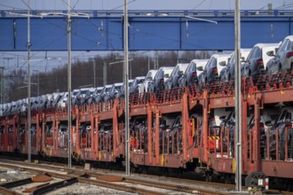 Car train, goods train on its way to the car terminal in Bremerhaven seaport, new German cars for