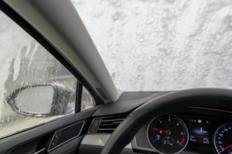 Car in an automatic car wash, car wash tunnel