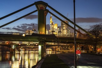 Skyline of the city centre of Frankfurt am Main, raft bridge over the river Main, dusk, Hesse,