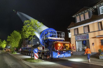 Transport of a 68 metre long, 22 tonne blade of a wind turbine, here in Breckerfeld-Waldbauer, with