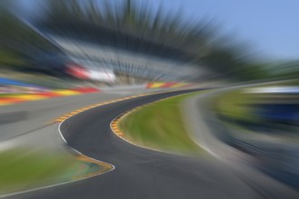 Photo of Eau Rouge with dynamic speed effect with view tunnel view from racing car perspective of