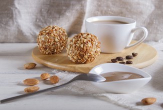 Energy balls cakes with nuts on wooden board on linen napkin. selective focus, close up