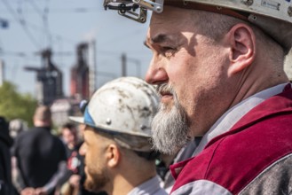 Steelworkers at a demonstration in front of the headquarters of ThyssenKrupp Steel Europe in