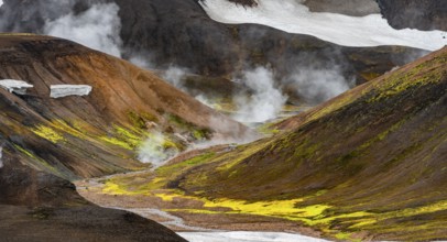 Colourful volcanic landscape with hills and snow, volcanic steaming hot springs, Laugavegur