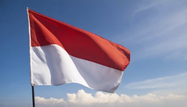 The flag of Indonesia flutters in the wind