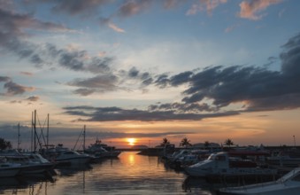 Sunset with cloud sky on the pier with yachts in malaysia