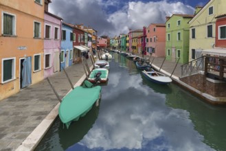 Colourful houses on the canal in Burano, Venice, Italy, Europe