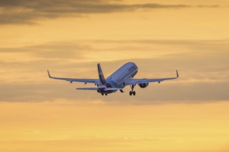 Passenger aircraft in front of a cloudy morning sky, sunrise, Eurowings, Baden-Württemberg,