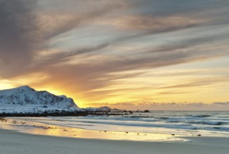 Sunset in winter at Skagsanden, stones on the beach at Flakstad, Flakstadøy, Lofoten, Nordland,