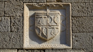 Small square stone relief with a coat of arms and a partially legible inscription, Knights' Street,
