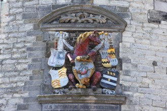 City coat of arms with unicorn on the historic Hoofdtoren defence defence tower in the harbour of