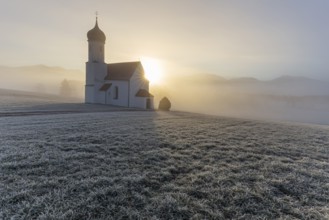 Chapel at sunrise in front of mountains, sunbeams, backlight, hoarfrost, Sankt Johannisrain, Alpine