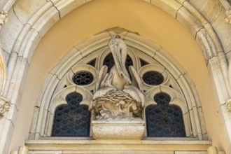 Pelican as a Christian symbol above the entrance gate to the Jakobikirche, Freiberg, Saxony,