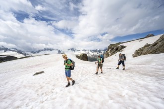 Three mountaineers crossing a snowfield, ascent to the Nördliche Mörchnerscharte, Berliner