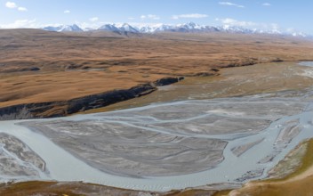 Aerial view, Burkhan mountain valley with meandering river, barren dramatic mountain landscape,
