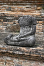 Buddha statue without head in Wat Mahathat Ayutthaya, Temple of the Great and Holy Relic,