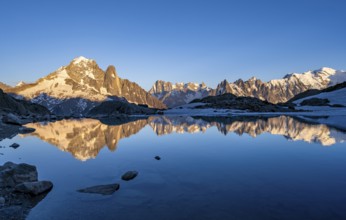 Evening mood, mountain landscape at sunset, alpenglow, water reflection in Lac Blanc, mountain