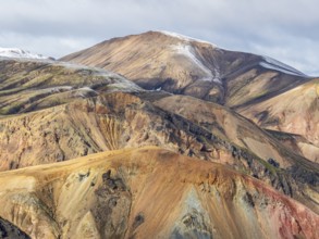 Early snow on the colorful rhyolite mountains, mt. Brennisteinsalda, lava fields, Landmannalaugar,