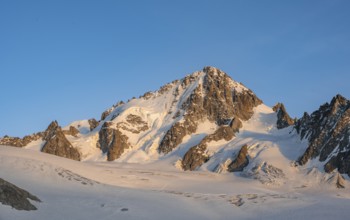 High alpine mountain landscape at sunset, summit of the Aiguille de Chardonnet and Glacier du Tour