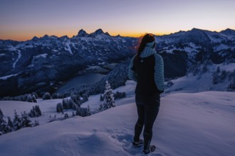 Hiking in the snow in the snow-covered winder landscape in the Alps at Neunerköpfle in the
