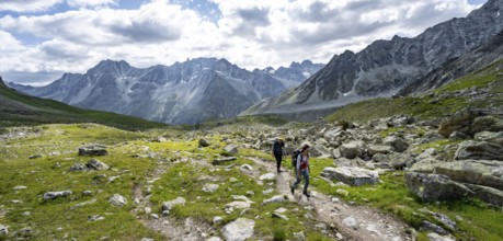 Mountaineer on a hiking trail, mountain landscape near Arolla, ascent to Col de Riedmatten, Valais,