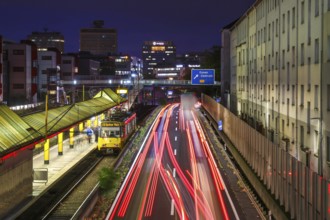 Essen, North Rhine-Westphalia, Germany, A40 motorway in the city centre at dusk. Underground line