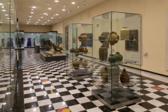 Interior of city museum, Campeche city, Campeche State, Mexico display cabinets of pottery and