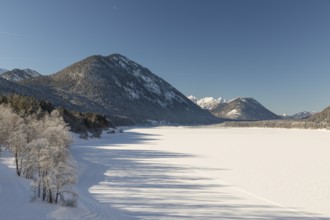 Frozen Sylvenstein reservoir, covered with snow. Isar valley in winter at temperatures of minus 18