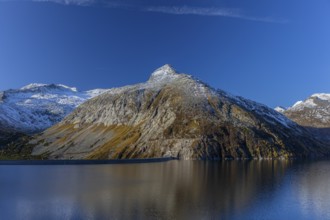 Kölnbrein reservoir and the Oberlecherspitzen mountain on a bright sunny morning. Seen from the