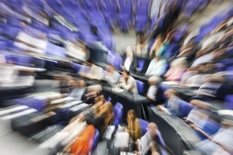 Zoom effect photo, Member of Parliament in the plenary hall of the German Bundestag, Berlin, 13