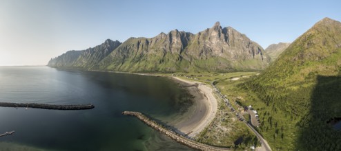 Panoramic aerial view of campsite at beach Ersfjordstranden, fjord Ersfjord, golden restroom, Senja