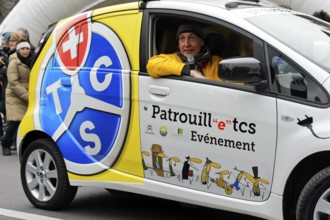 Support vehicle sponsored by the Touring Club Switzerland, TCS, with the course announcer at the