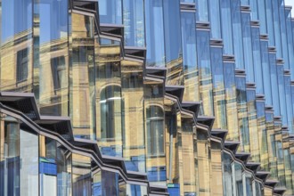 Robert Koch Forum reflected in glass façade opposite, Hertie School private university, building