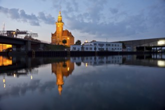 The old harbour office in the neo-renaissance style in the harbour in Dortmund at dusk, North