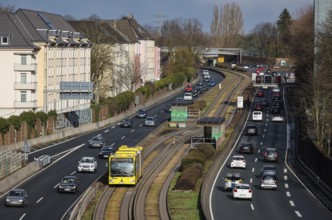 Essen, North Rhine-Westphalia, Germany - Cars and a public bus drive through Essen city centre on