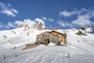 Chamanna d'Es-cha mountain hut in a wintry mountain landscape, Grisons Haute Route ski tour, Albula