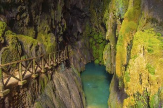 Beautiful colours inside the Iris Grotto at the Cola de Caballo Waterfall in the Monasterio de