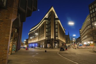 Chilehaus at night, viewed from below, brick façade illuminated, lettering visible, Hamburg,
