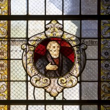 Stained glass window with Martin Luther in the Evangelical Lutheran Market Church of St Cosmas and
