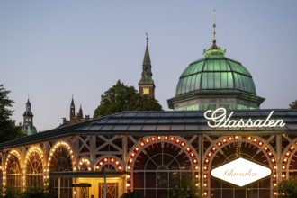 Illuminated theatre hall Glass Hall or Glassalen, architect Poul Henningsen, dusk, Tivoli Amusement