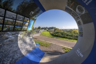 Original sewer pipe element of the Emscher sewer as an information stand in Emscherland, a new