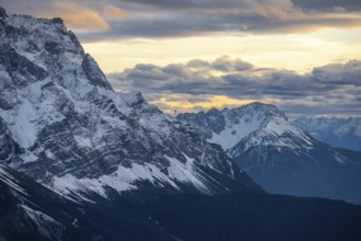 Mountain peak of the Zugspitze with snow in autumn, Wetterstein mountains at sunset, view from