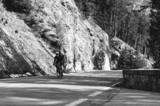 Road bike rider in spring between Lechtal and Tannheimer Tal in front of picturesque scenery of the